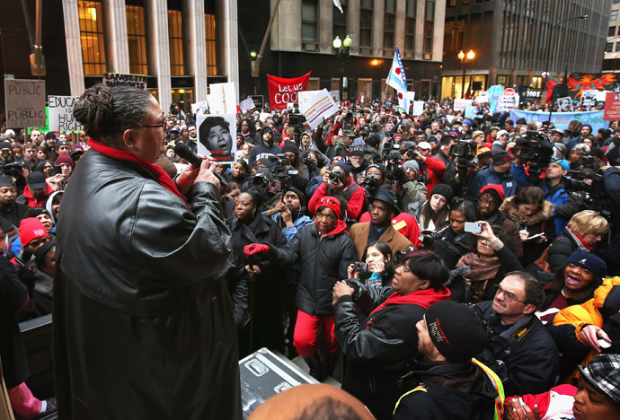 Chicago Teachers Union President Karen Lewis speaks to demonstrators protesting school closings on March 27, 2013 in Chicago, Illinois. About 2,000 protestors held a rally and marched through downtown to protest a plan by the city to close more than 50 elementary schools, claiming it is necessary to rein in a looming $1 billion budget deficit. (Scott Olson/Getty Images/AFP)