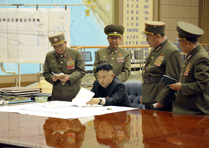 North Korean leader Kim Jong-Un discussing the strike plan with North Korean officers during an urgent operation meeting at the Supreme Command in an undisclosed location (AFP PHOTO / KCNA via KNS)