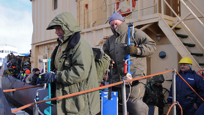 Fishermen leave a rescue ship at the Riga Port Authority on March 29, 2013 in Riga.(AFP Photo / Edijs Palens)