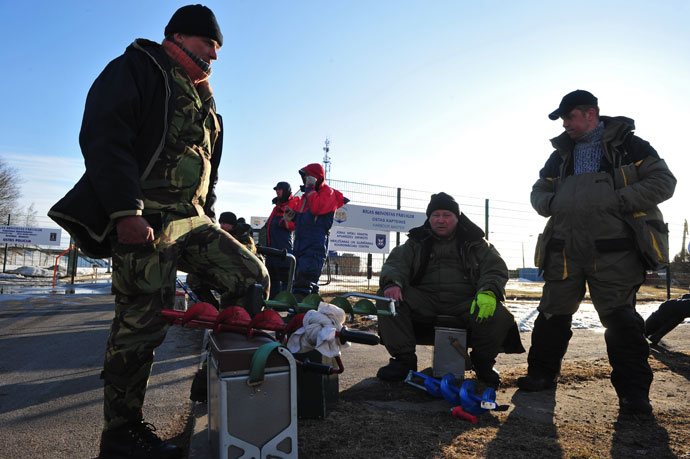 Rescued fishermen are pictured after leaving the Riga Port Authority on March 29, 2013 in Riga.(AFP Photo / Iilmrs Znotins)