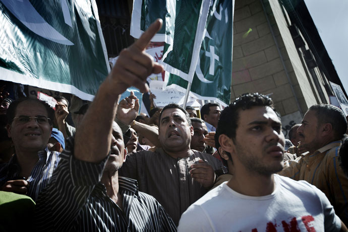Hundreds of Egyptian political activists, victims and prisoners' relatives shout slogans during a protest against current prosecutor general Talaat Abdallah outside Cairo High Court on March 29, 2013 in Egypt.(AFP Photo / Gianluigi Guercia)