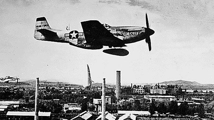 This August,1951 photo shows an P-51 "Mustang" a split second after it dropped two napalm fire bombs over a North Korean target. North Korean troops invaded South Korea 25 June, 1950, marking the beginning of the Korean War.(AFP Photo / National Archives)