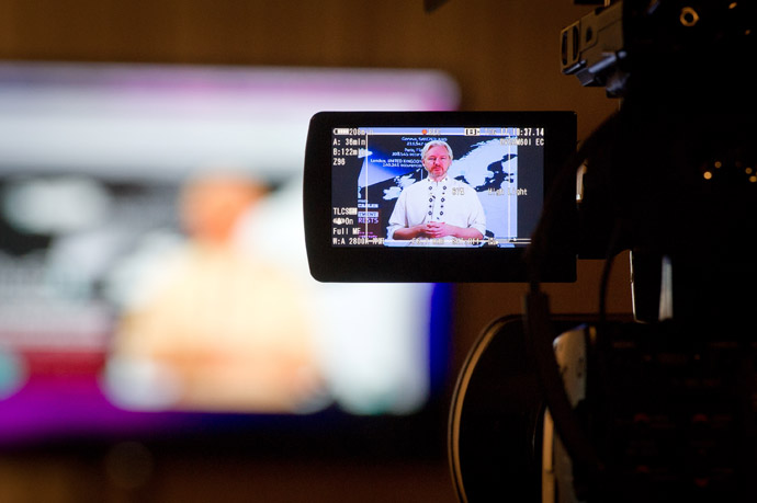 Whistleblowing website WikiLeaks founder Julian Assange (on the screen) speaks during a teleconference between London and Washington on April 8, 2013 in Washington, DC. (AFP Photo/Mladen Antonov)