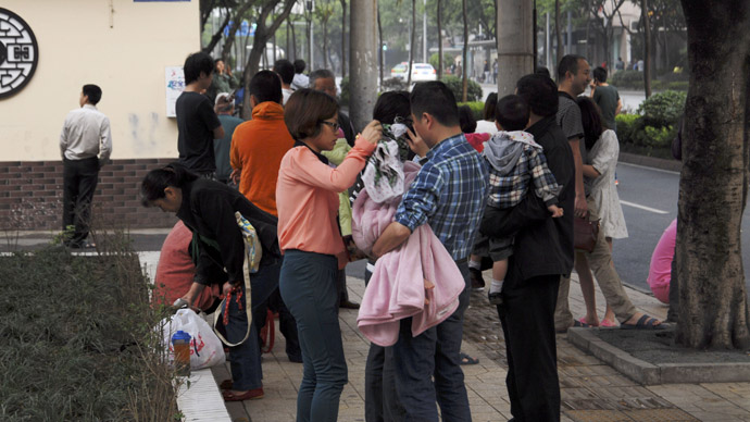 Residents gather outside their homes after a 6.6 magnitude earthquake which struck near Ya'an city, in Chengdu, Sichuan province, April 20, 2013. (Reuters)