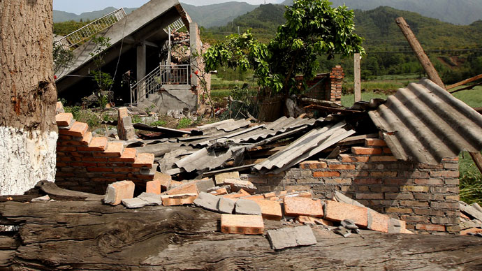 Damaged houses are seen in Longmen township, an area very close to the epicenter of a shallow earthquake at magnitude 7.0 that hit the city of Ya'an, southwest China's Sichuan province on April 20, 2013.(AFP Photo / China Out)