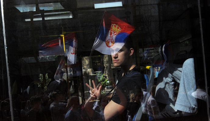 A man in a bus gestures during a protest on April 21, 2013, in Belgrade. Serbia (AFP Photo / Alexa Stankovic)