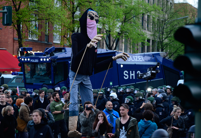 Protesters operate a giant puppet dressed a a demonstrant as they take part in the 'Revolutionary' May Day demonstration on May 1, 2013 in Berlin (AFP Photo / John Macdougall)