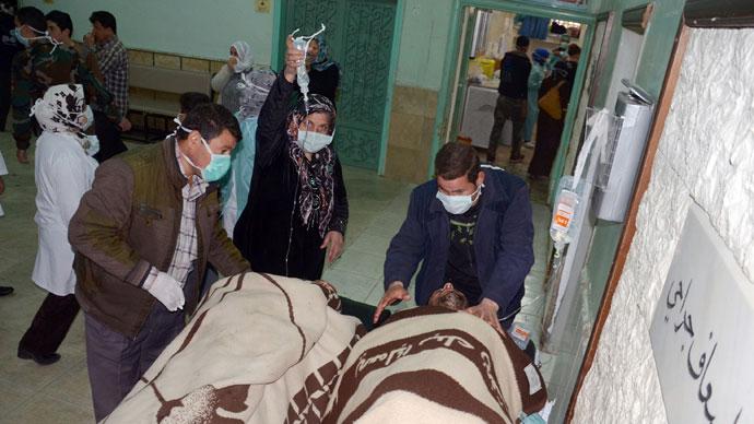 People are brought into a hospital in the Khan al-Assal region in the northern Aleppo province, as Syria's government accused rebel forces of using chemical weapons for the first time. The opposition denied the claim, saying instead that government forces might have used banned weapons.(AFP Photo / HO-SANA)