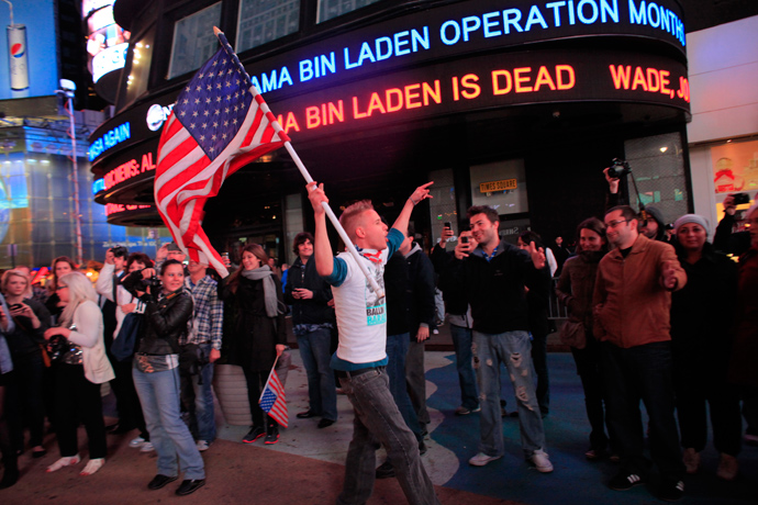 People react to the death of Osama bin Laden in Times Square in New York early May 2, 2011 (Reuters / Eric Thayer)