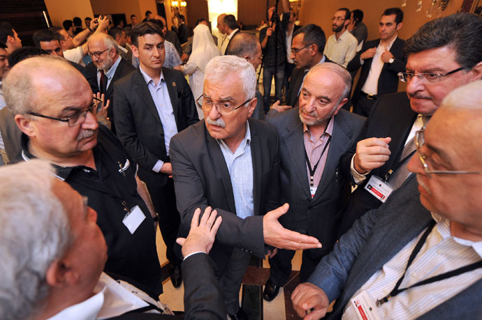 President of the Syrian National Council (SNC) George Sabra (C) talks with other Syrian opposition members during a break at the Syrian opposition meeting in Istanbul, on May 25, 2013.(AFP Photo / Ozan Kose)