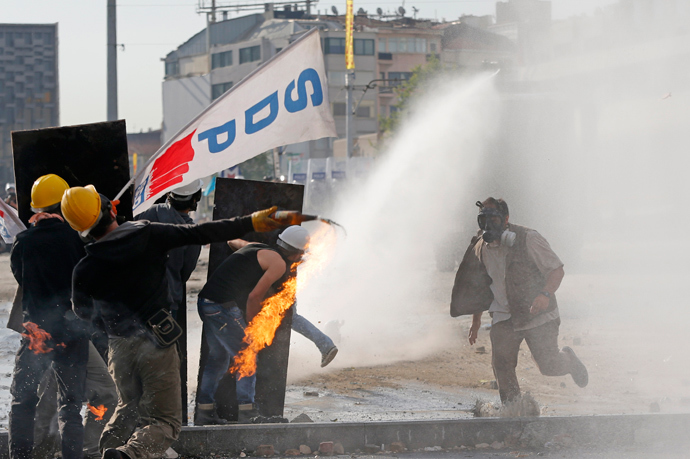 A crowd control vehicle fires a water cannon against protesters during a protest at Taksim Square in Istanbul June 11, 2013 (Reuters / Murad Sezer)