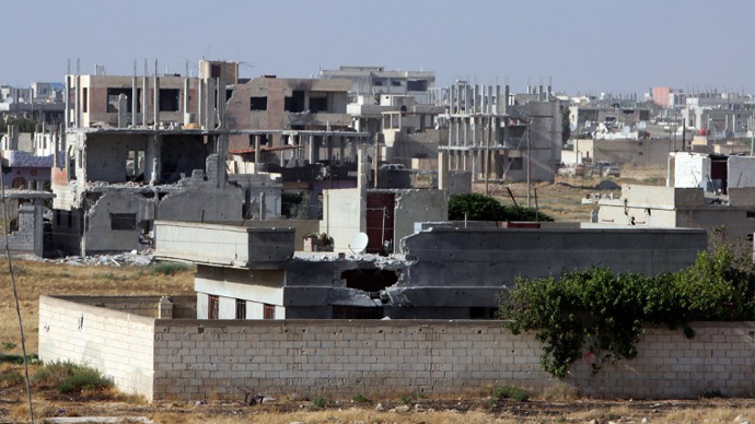 A partial view of the city of Qusayr, in Syria's central Homs province, as the Syrian army forces battle opposition fighters, on May 25, 2013. (AFP Photo)