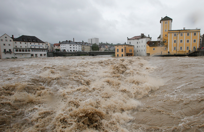 Flooded houses next to river Steyr are pictured during heavy rainfall in the small Austrian city of Steyr June 2, 2013 (Reuters / Leonhard Foeger)