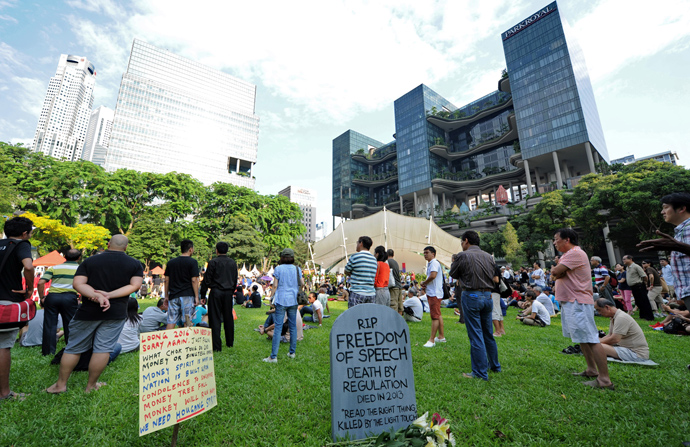 People gather to listen to bloggers speeches during a rally at a free-speech park called Speakers' Corner in Singapore on June 8, 2013 (AFP Photo / Roslan Rahman)