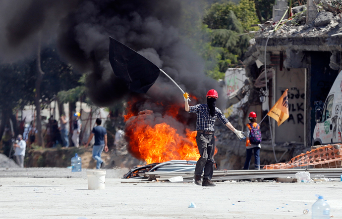 A protester taunts riot police during a protest at Taksim Square in Istanbul June 11, 2013 (Reuters / Murad Sezer)