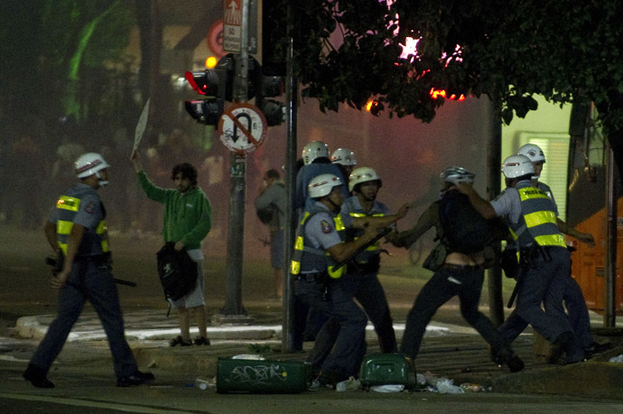 A demonstrator is arrested by police during a demonstration in downtown Sao Paulo, Brazil on June 13, 2013, against a recent rise in public bus and subway fare from 3 to 3.20 reais (1.50 USD). (AFP Photo/Nelson Almeida)