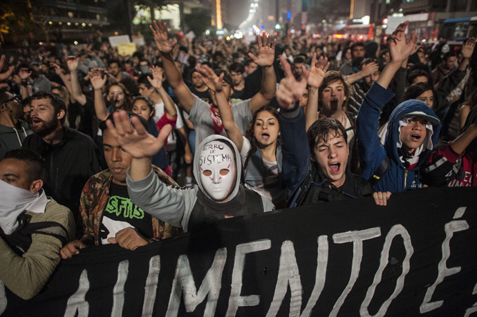 Students protest against the rise in public bus and subway fares from 3 reais to 3.20 reais (1.50 USD) in Sao Paulo on June 11, 2013. (AFP Photo/Nelson Almeida)