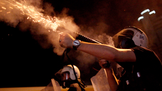 Riot police fires tear gas towards protesters during clashes in Kennedy street in central Ankara June 18, 2013 (Reuters / Dado Ruvic)