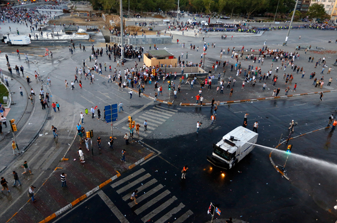 Riot police fire a water cannon at Taksim Square in Istanbul June 22, 2013 (Reuters / Marko Djurica)