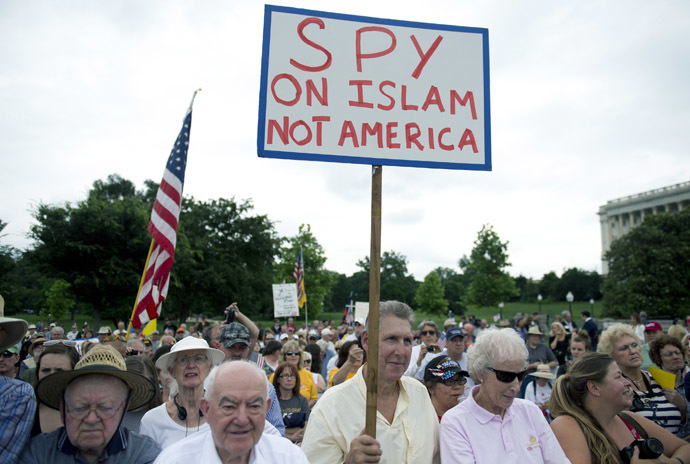 Demonstrators with the Tea Party protest the Internal Revenue Service (IRS) targeting of the Tea Party and similar groups during a rally called "Audit the IRS" outside the US Capitol in Washington, DC, June 19, 2013. (AFP Photo/Saul Loeb)