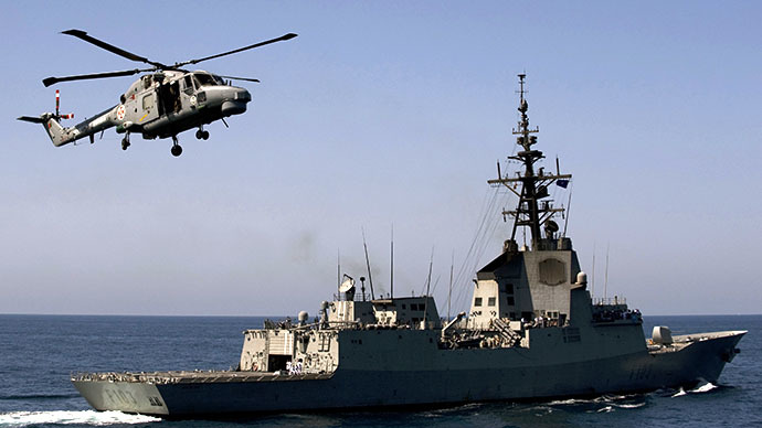 An helicopter flies over Spanish frigate "Blas de Lezo" during manouvers at Spanish exercise areas outside the port of Rota, southern Spain (AFP Photo / Jorge Guerrero)