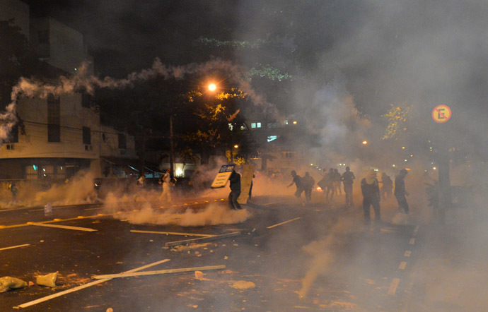 Rio de Janeiro : Violent demonstrators receive tear gaz during a protest in a street near the Maracana stadium of Rio de Janeiro on June 30, 2013, a few hours before the final of the Fifa Confederations Cup football tournament between Brazil and Spain. (AFP Photo)