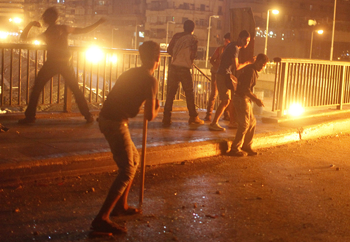 Protesters, who are against former Egyptian President Mohamed Morsi, demonstrate near pro-Morsi supporters, near Tahrir Square in Cairo July 5, 2013. (Reuters / Asmaa Waguih)
