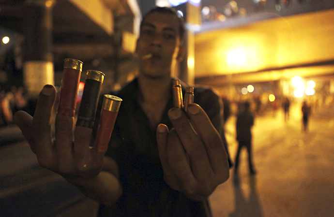 An anti-Morsi protester shows spent shell casings and rubber bullets during clashes with members of the Muslim Brotherhood and supporters of ousted Egyptian President Mohamed Morsi near Maspero, Egypt's state TV and radio station, near Tahrir square in Cairo July 5, 2013. (Reuters / Amr Dalsh)