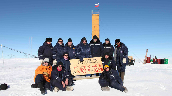 A handout photo provided by the Russiaâs Arctic and Antarctic Research Institute taken at the Vostok station in Antarctica on February 5, 2012, shows Russian researchers posing for a picture after reaching the subglacial lake Vostok (AFP Photo)