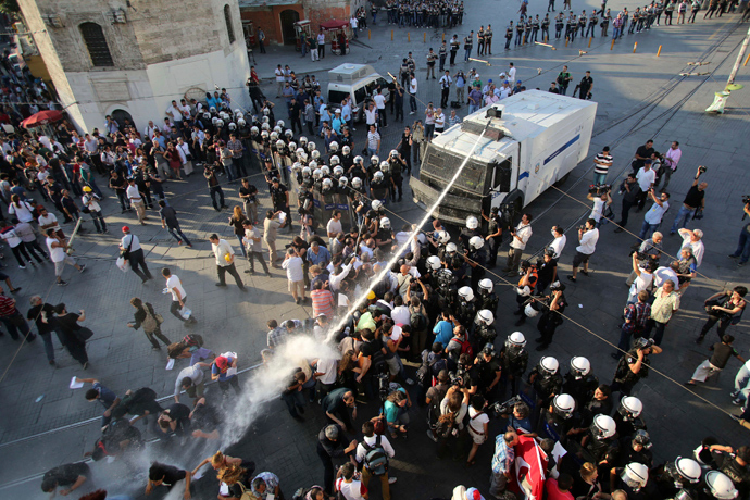 Riot police use a water cannon to disperse demonstrators during a protest at Taksim Square in central Istanbul (Reuters / Serkan Senturk)