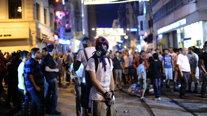 Protestors stand near a barricade on July 14, 2013 on Istiklal Avenue in the center of Istanbul.(AFP Photo / Bulent Kilic)