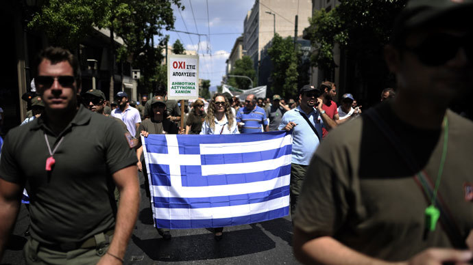 Municipal police members demonstrate during a general strike in Athens on July 16, 2013.(AFP Photo / Aris Messinis)