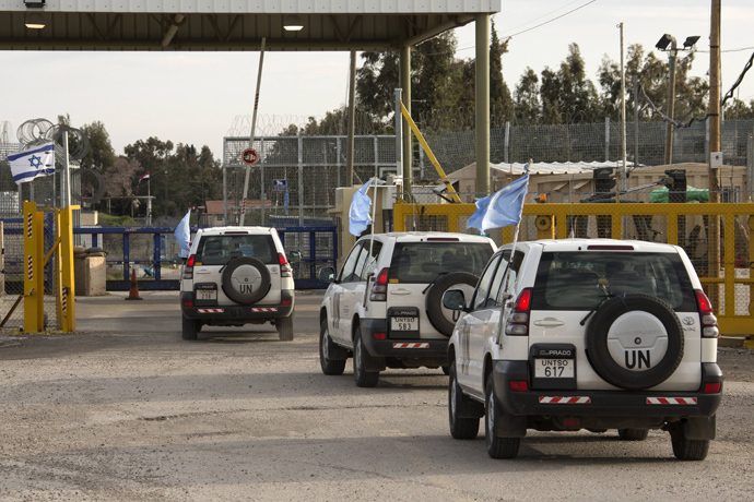 UN peacekeeper vehicles cross the Quneitra checkpoint between Israel and Syria (AFP Photo / Jack Guez)