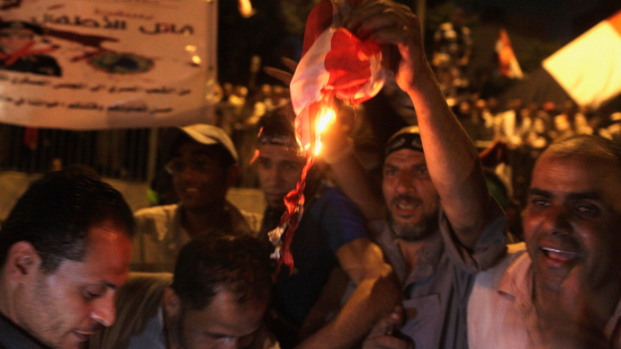 Egypt’s army fires tear gas at pro-Morsi protesters near presidential palace