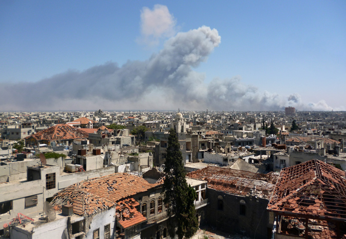 A handout image released by the Syrian opposition's Shaam News Network on August 1, 2013, shows smoke billowing from the site of an ammunitions depot blast in the Wadi al-Zahab district of Homs in central Syria (AFP Photo / HO / Shaam News Network)