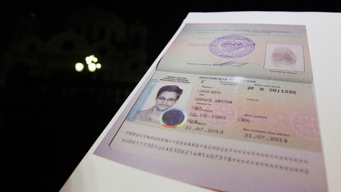 Fugitive former U.S. spy agency contractor Edward Snowden's new refugee documents granted by Russia is seen during a news conference in Moscow.(Reuters / Maxim Shemetov)
