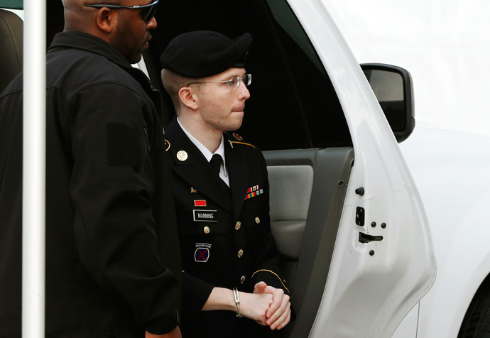 U.S. soldier Bradley Manning is escorted into court to receive his sentence at Fort Meade in Maryland August 21, 2013 (Reuters / Kevin Lamarque)
