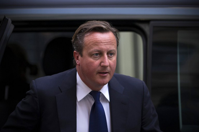British Prime Minister David Cameron arrives at 10 Downing Street in central London on August 27, 2013, after returning early from a holiday to address the Syria crisis. (AFP Photo / Carl Court)