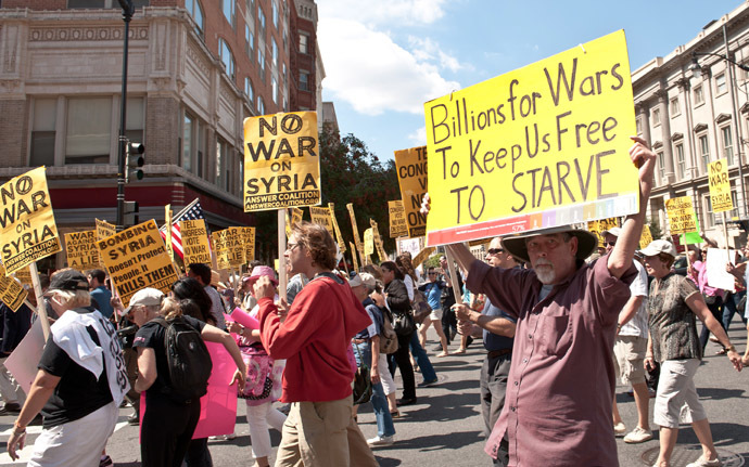 People march from the White House to the US Capitol in Washington against US intervention in Syria on September 7, 2013. (AFP Photo/Nicholas Kamm)