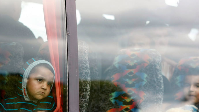 Romanians leave the Ozone Leisure Centre to spend the night in sheltered accommodation, Belfast.(Reuters / Cathal McNaughton)