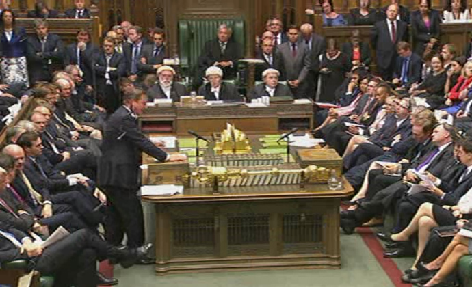 A video grab from footage broadcast by the UK Parliamentâs Parliamentary Recording Unit (PRU) via Parliament TV on August 29, 2013 shows British Prime Minister David Cameron (L) speaking at the dispatch box during the debate about a response to the situation in Syria in the Houses of Parliament in central London on August 29, 2013 (AFP Photo)