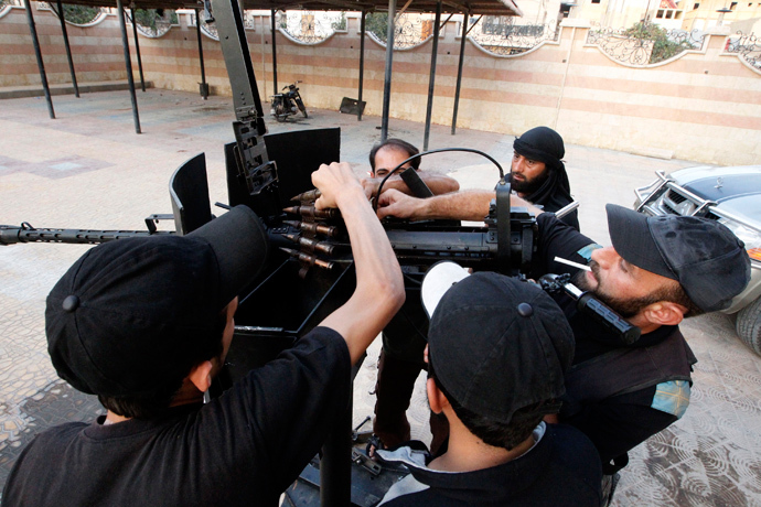Free Syrian Army fighters clean and inspect their weapon in Raqqa province, eastern Syria September 1, 2013 (Reuters / Nour Fourat)