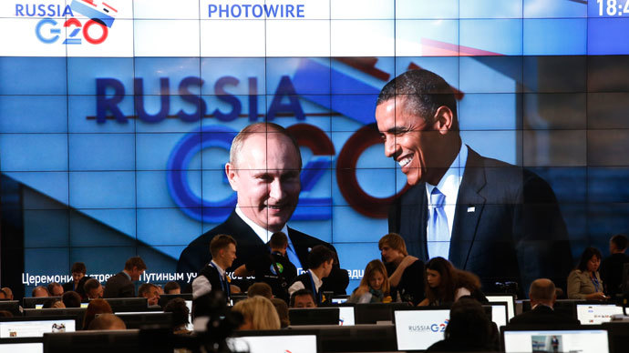 Russian President Vladimir Putin (L) and U.S. President Barack Obama are pictured on a video screen installed in the press centre of the G20 Summit in Strelna near St. Petersburg, September 5, 2013.(Reuters / Grigory Dukor)