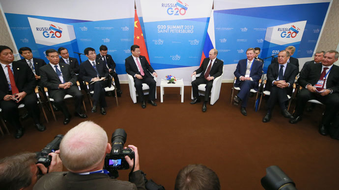 President of the Russian Federation Vladimir Putin, fourth right, and President of the Peopleâs Republic of China Xi Jinping, fifth right, meet on the sidelines of the G20 Leaders' Summit in Strelna.(RIA Novosti / Anton Denisov)