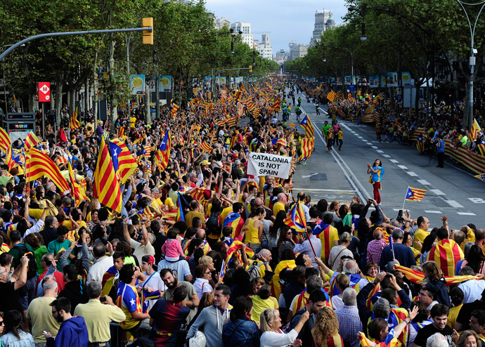Catalans gather to create a 400-kilometre (250-mile) human chain, part of a campaign for independence from Spain during Catalonia National Day, or Diada, at the Pasea de Gracia in Barcelona, on September 11, 2013 (AFP Photo / Josep Lago)