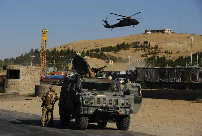 A US military helicopter flies overhead during an attack on the US consulate in Herat on September 13, 2013. (AFP Photo/Aref Karimi)