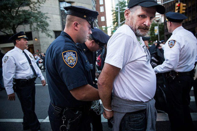 A man is arrested for allegedly blocking traffic during an Occupy Wall Street march from the United Nations building to Bryant Park on September 17, 2013 in New York City. (AFP Photo / Andrew Burton)