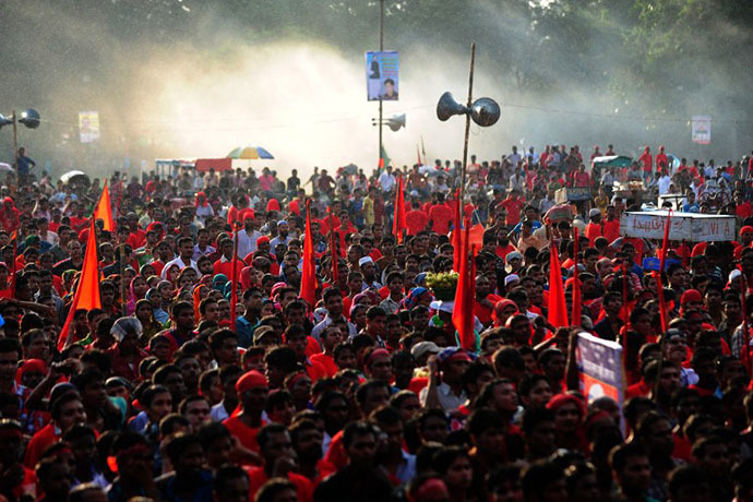 Bangladeshi garment workers shout slogans during a protest asking for wage increase in Dhaka on September 21, 2013. (AFP Photo / Munir Uz Zaman)