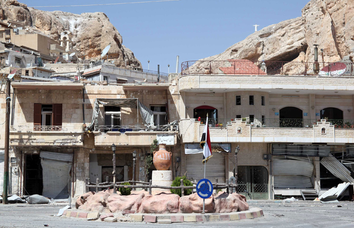 A picture shows damaged buildings in the Syrian Christian town of Maalula on September 13, 2013. Syria's opposition National Coalition said it was "deeply sceptical" about the government's decision to join a chemical weapons ban and urged a tough UN resolution to enforce the measure (AFP Photo / STR)
