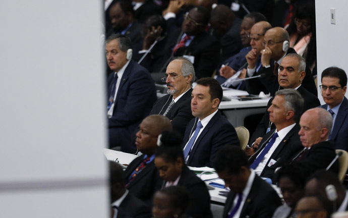 Syria's Ambassador to the United Nations Bashar Ja'afari (2ndL) listens to U.S. President Barack Obama (NOT PICTURED) address the 68th United Nations General Assembly at UN headquarters in New York, September 24, 2013. (Reuters/Shannon Stapleton)